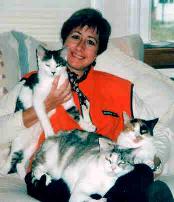 Paula on couch w/ kitties