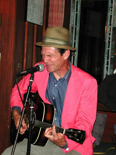 blues man in a pink jacket